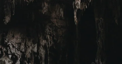 Men on a trail inside a giant cave Stock Footage 162524790
