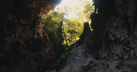 Men on a trail inside a giant cave Stock Footage 162524941