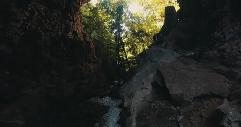 Men on a trail inside a giant cave Stock Footage 162525014