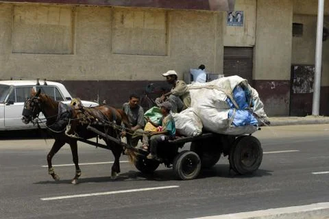 Men transport garbage Stock Photos