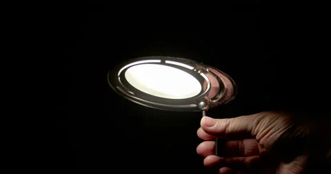 Men turning off lamp / Slow motion Stock Footage 130984946