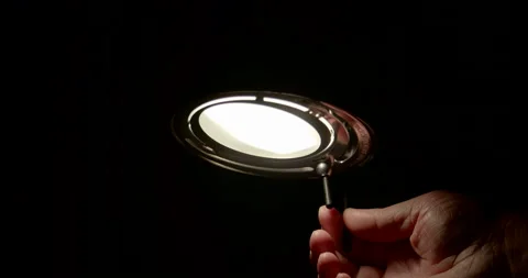 Men turning on lamp / Slow motion Stock Footage 130985000