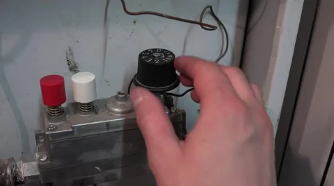 Men Turns Valve and Enable Blue Flames of Gas Burning Inside of a Boiler. 4K Ult Vídeos de archivo 48623661