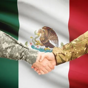Men in uniform shaking hands with flag on background - Mexico Stock Photos