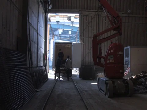 Men unloading a truck in warehouse Stock Footage 71248273