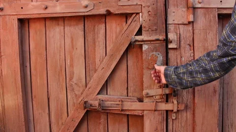 A men unlocks the door using key Stock Footage 65448287