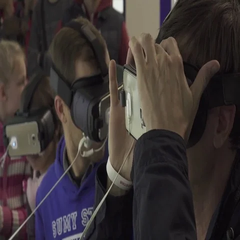 Men uses a virtual reality device. VR headset with stereoscopic 3D content Stock Footage 69653556