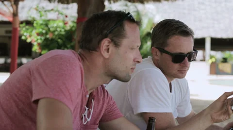 Men using cellphone and smiling, steadycam shot Stock-Footage 39216844