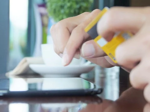 Men using computer for on line purchase with credit card Stock Footage 69774897