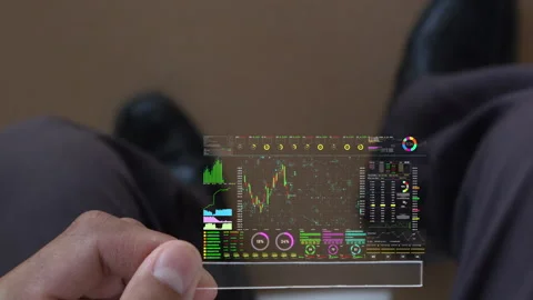 A men using digital tablet for analyze a stock market exchange. Stock Footage 245325986