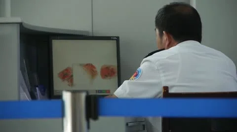 Men using electronic scanner to check items at airport &amp; railway station. Stock Footage 14832140