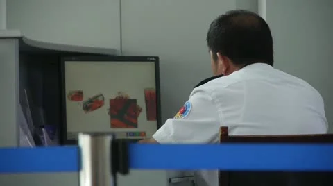 Men using electronic scanner to check items at airport &amp; railway station. Video stock 14832211