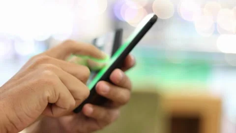 Men Using Her Smartphone Outside. Hands Scrolling Screen Closeup Tapping Video stock 336249241