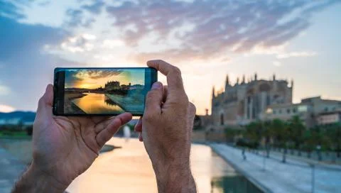 Men using her smartphone for take a photo in Palma de Mallorca Stock Photos