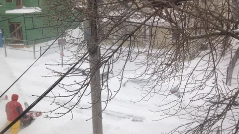Men Using A Snowblower On a Road While Snow Falls, 2015 Stock Footage 88228168