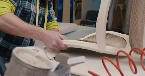 Men using soldering gun to making a chair 2 Stock Footage 131744097