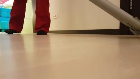 Men vacuuming the couch with a   flooring Video stock 86058706
