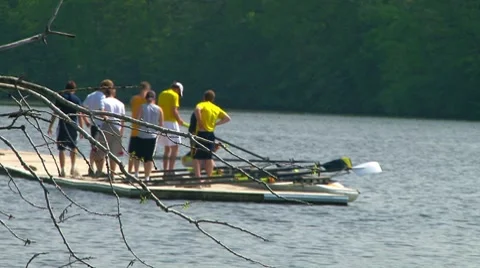 Men waiting coach and instructor before boarding their scull Stock Footage 7900339