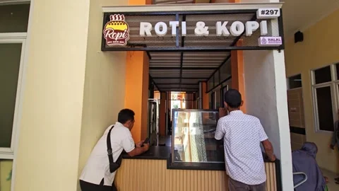 Men Waiting At A Local Coffee And Bread Stall In A Corridor Stock Footage 340013298