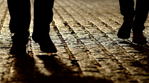 Men walking on cobblestones Stock-Footage 36610430