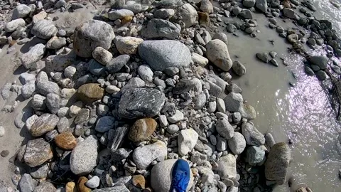 Men walking mountain river and stones Stock Footage 146043681