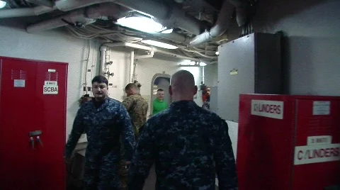 Men walking in passageway on Navy ship (HD)m Stock Footage 625118