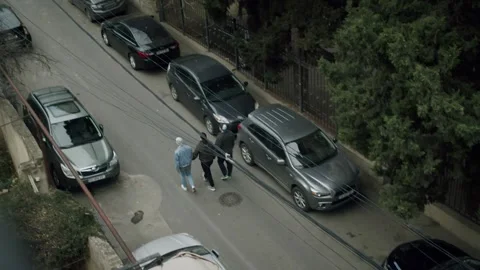 Men walking through Tbilisi Stock Footage 203890176