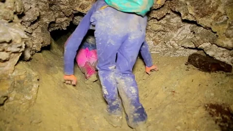 Men Walks in the Cave. Speleolog in the Cave Stock Footage 70146148