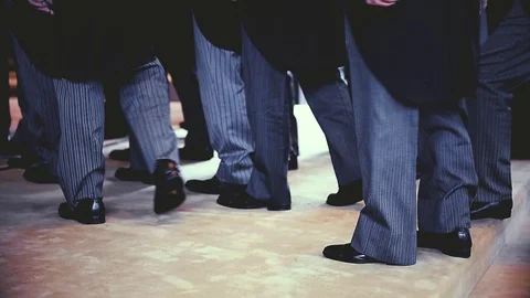 Men wearing the same tail coats at an official ceremony. Stock-Footage 120453098