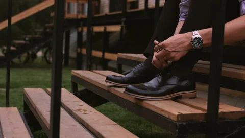 Men wearing work black boot. on the stairs Stock Footage 95910996