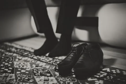 Men wearing work black boot, black and white photo Stock Photos