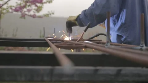 A men welding in a backyard Video stock 157748825