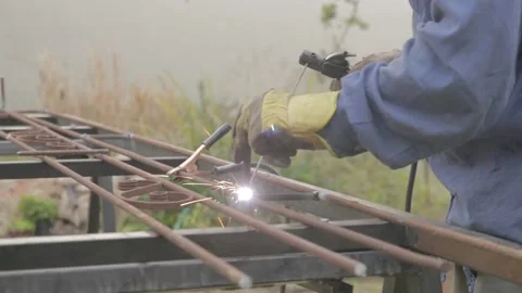 A men welding in a backyard Video stock 157749135