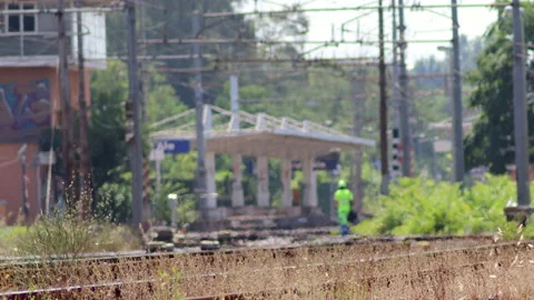 Men at work between the railroad tracks - 4K - ProRes Stock Footage 157972346