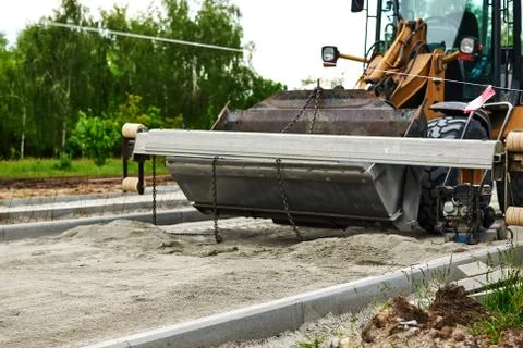 Men at work. The construction roller makes the road. Make a new road surface. Stock Photos