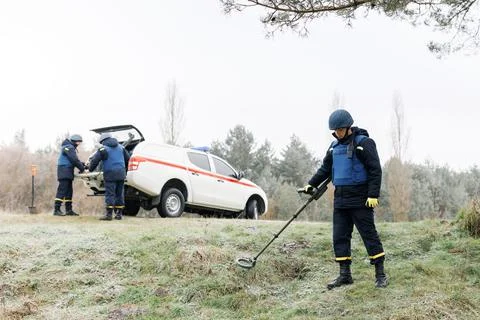 Men work in emergencies. Emergency workers work outdoors. A man in uniform wo Stock Photos