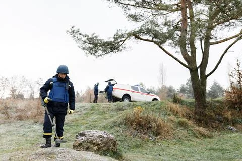 Men work in emergencies. Emergency workers work outdoors. A man in uniform wo Stock Photos