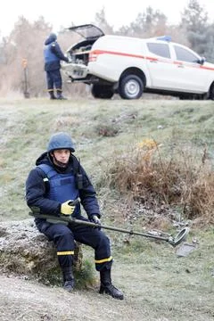 Men work in emergencies. Emergency workers work outdoors. A man in uniform wo Stock Photos
