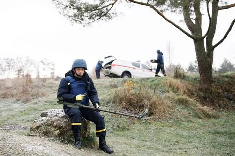 Men work in emergencies. Emergency workers work outdoors. A man in uniform wo Stock Photos