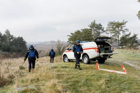 Men work in emergencies. Emergency workers work outdoors. A man in uniform wo Stock Photos