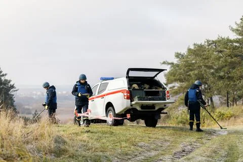Men work in emergencies. Emergency workers work outdoors. A man in uniform wo Stock Photos