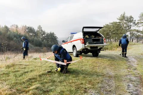 Men work in emergencies. Emergency workers work outdoors. A man in uniform wo Stock Photos