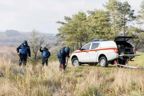 Men work in emergencies. Emergency workers work outdoors. A man in uniform wo Stock Photos
