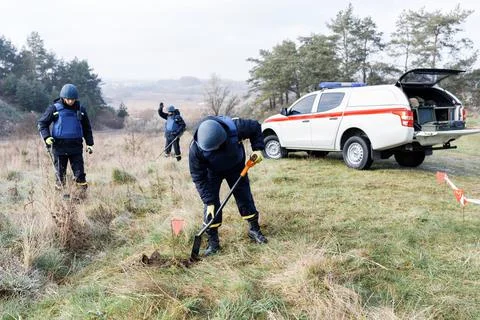 Men work in emergencies. Emergency workers work outdoors. A man in uniform wo Stock Photos