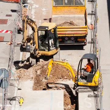 Men at work with excavator Stock Photos
