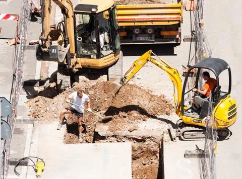 Men at work with excavator Stock Photos
