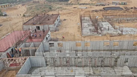 Men at work footage shows an under developing construction site Stock Footage 255890764