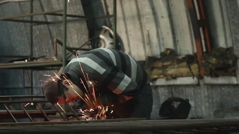 Men at work grinding steel Stock Footage 72068299