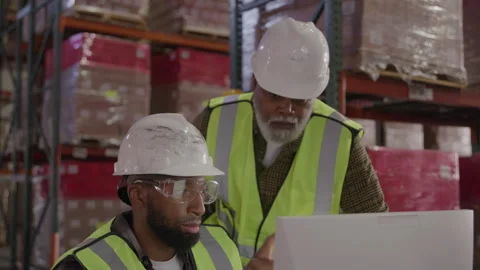 Men Work In Hard Hats At Computer In Warehouse Stock Footage 222008898