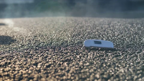Men at work. Measuring the temperature of freshly laid asphalt. Close-up of out Stock-Footage 138166623